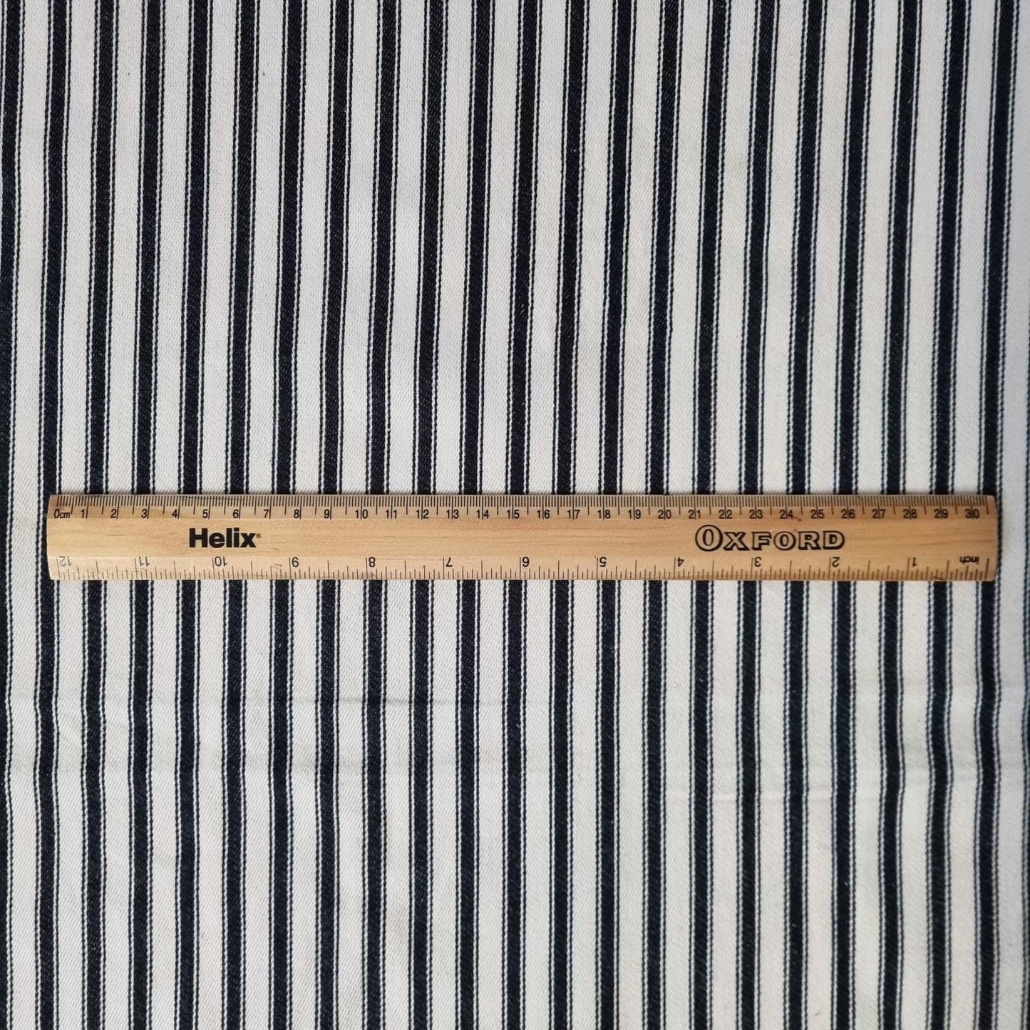 Soft Ticking Fabric with rule showing size of the black stripes