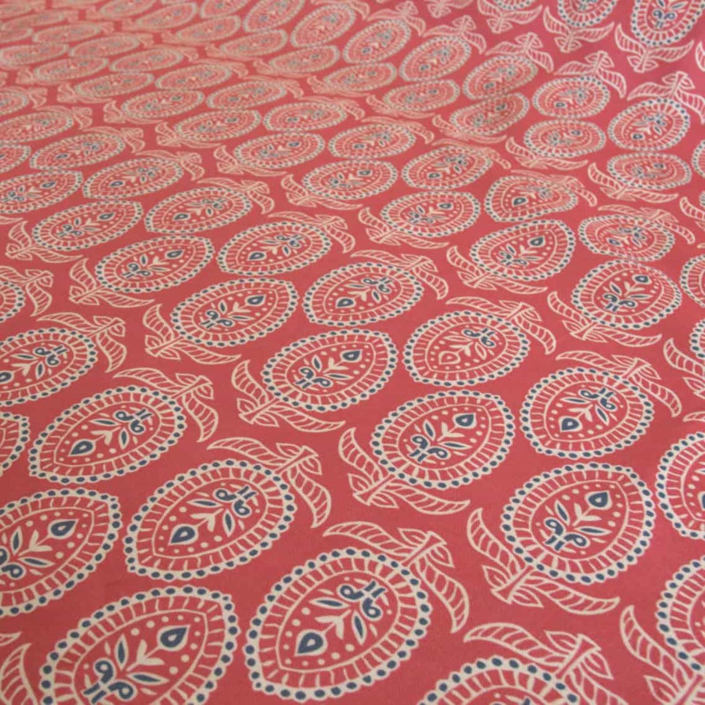 Red block print fabric with floral design