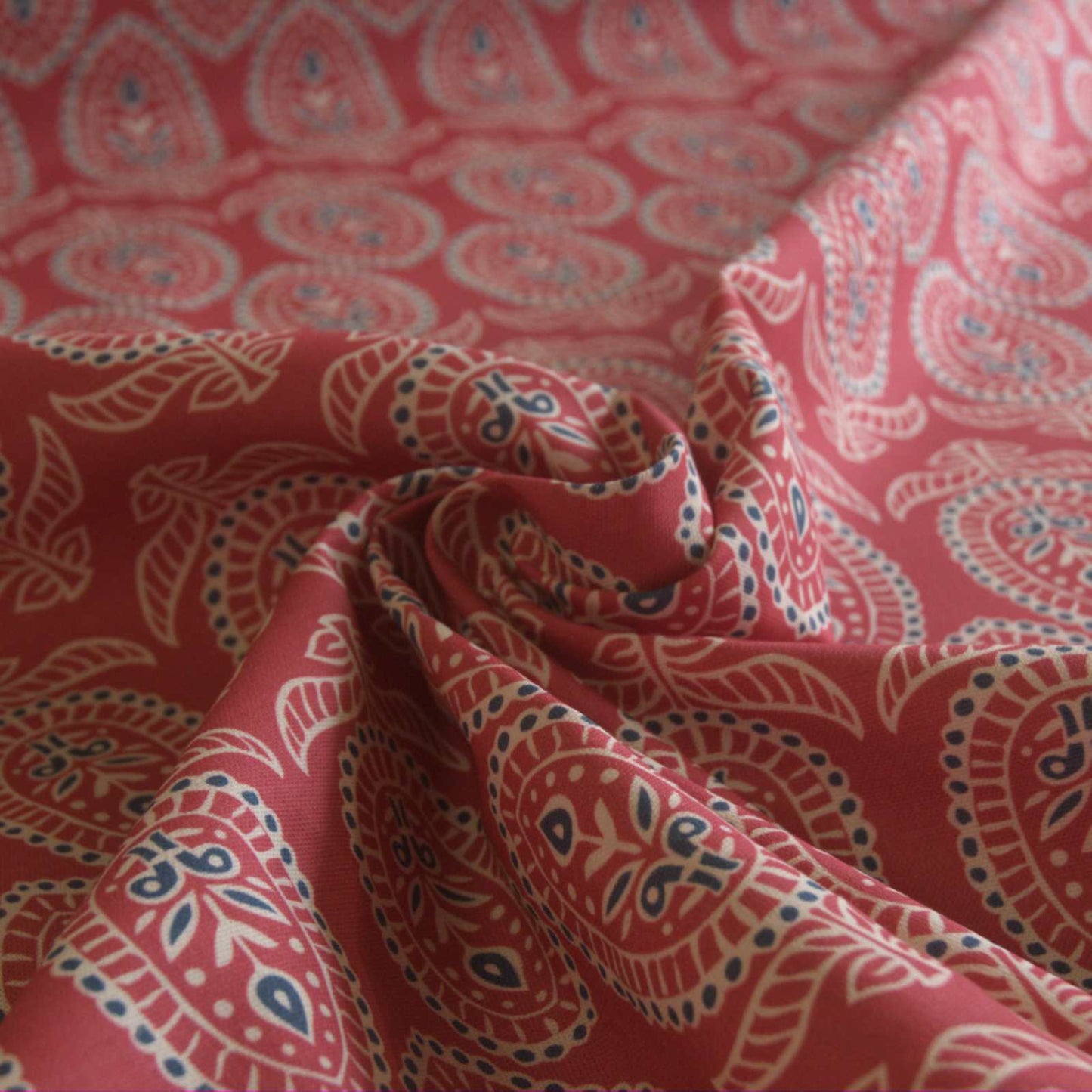 Curtain fabric with block print design on red background