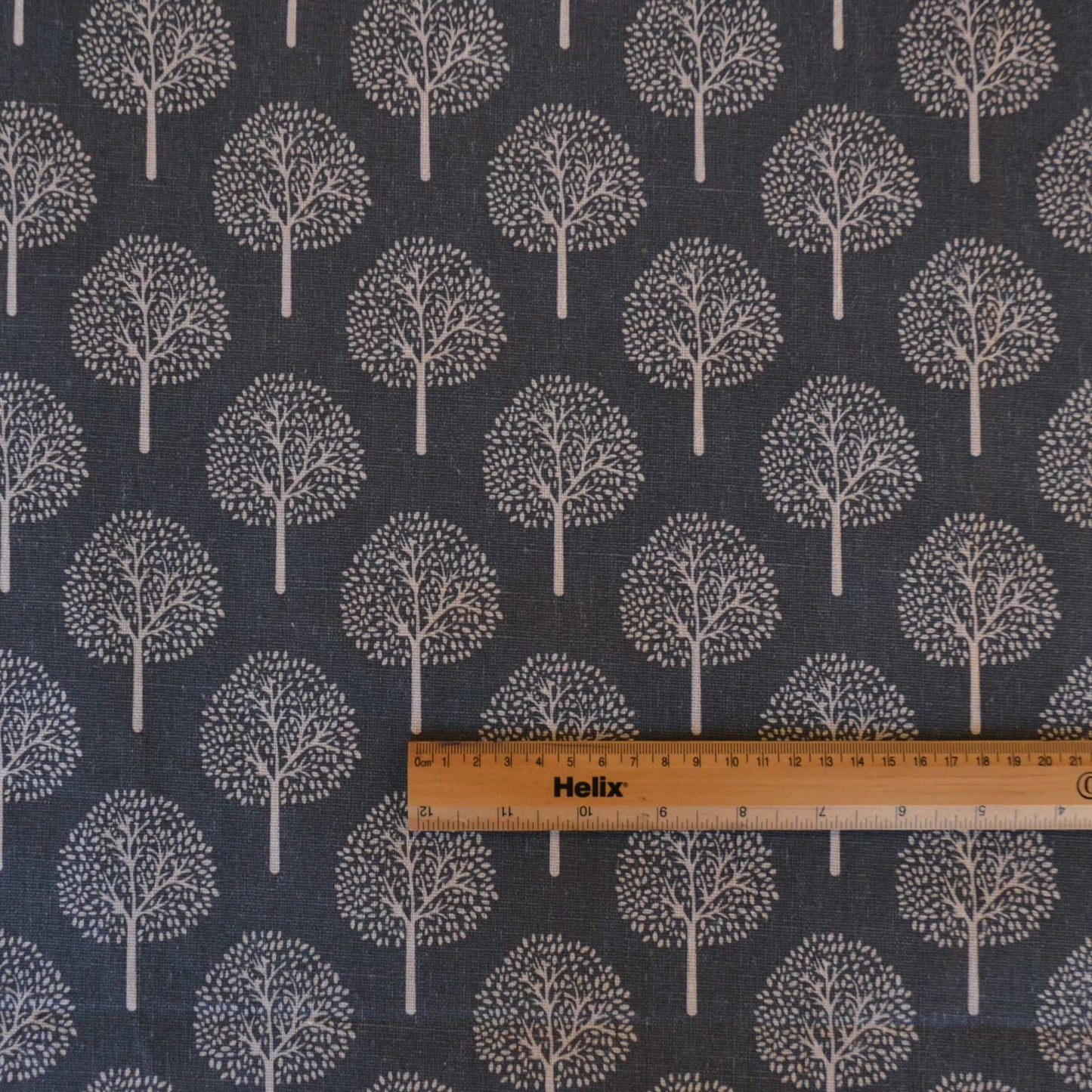 Dark Grey curtain or upholstery fabric with lighter trees with a rule for scale