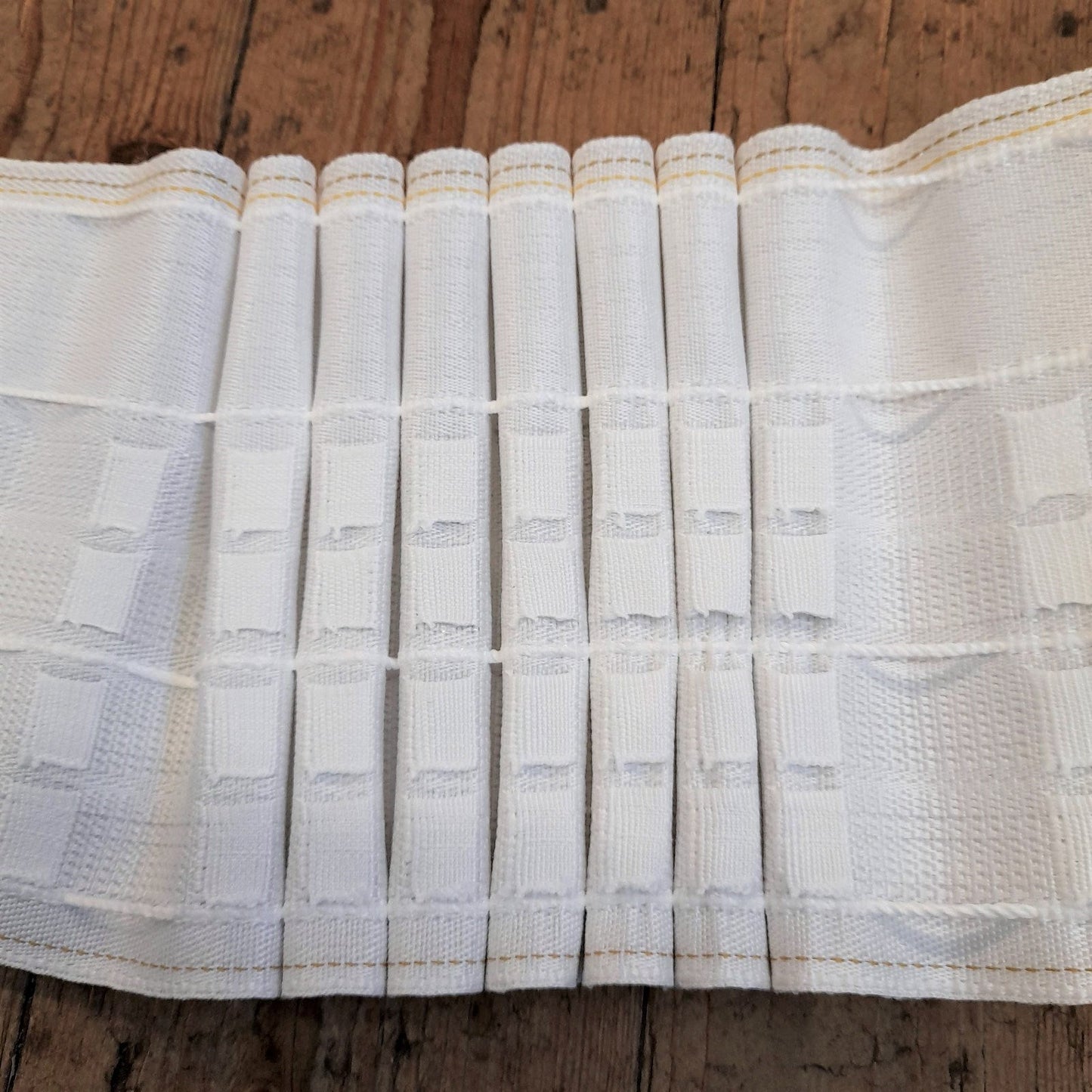 Deep size pencil pleat header tape with 4 hook positions shown gathered