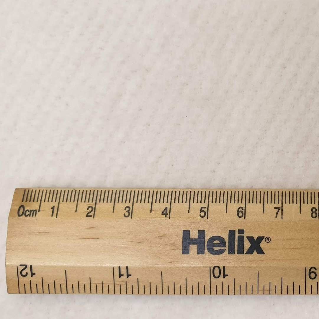 Cream cotton curtain interlining bump heavyweight with rule for scale