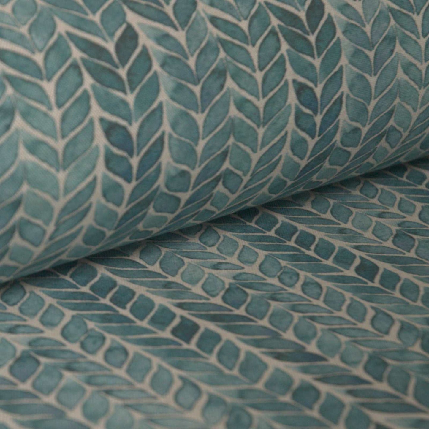 Teal blue leaf print forming stripes up the curtain fabric