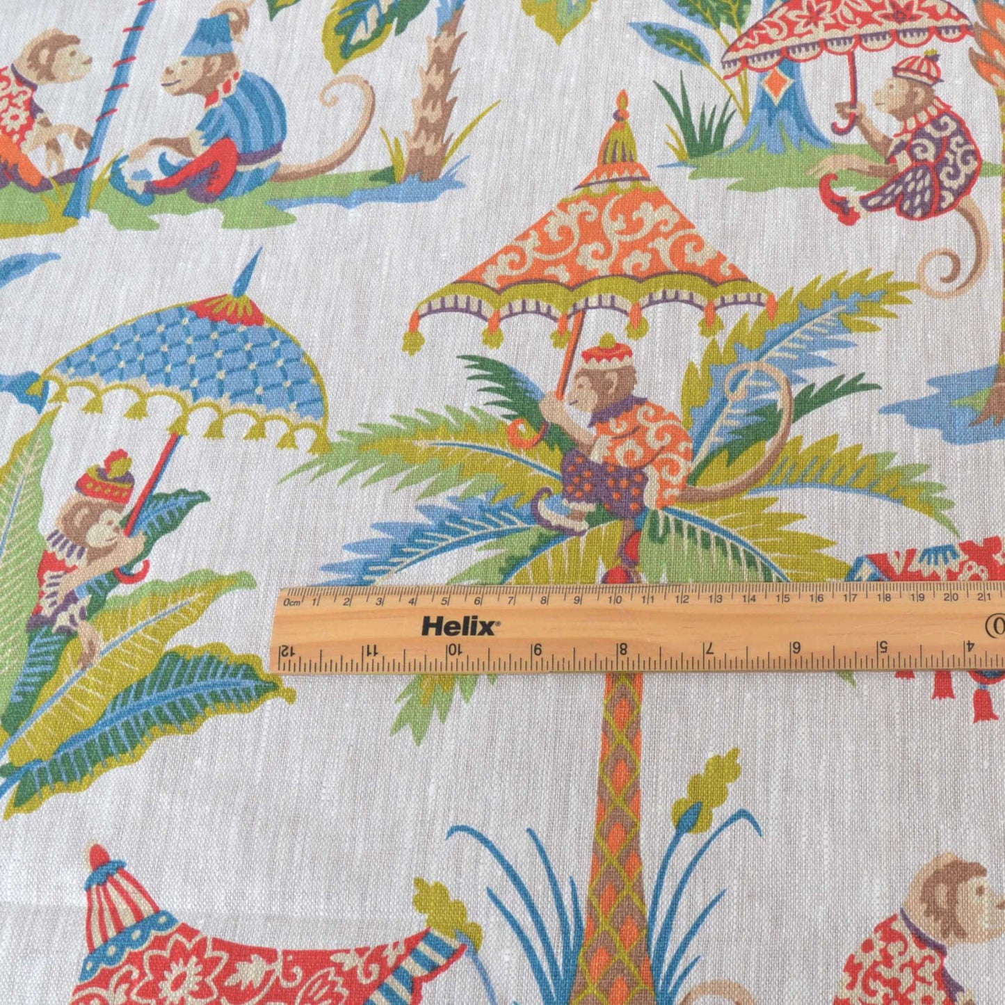 Curtain or upholstery fabric with rule showing scale of bright monkeys and parasols design