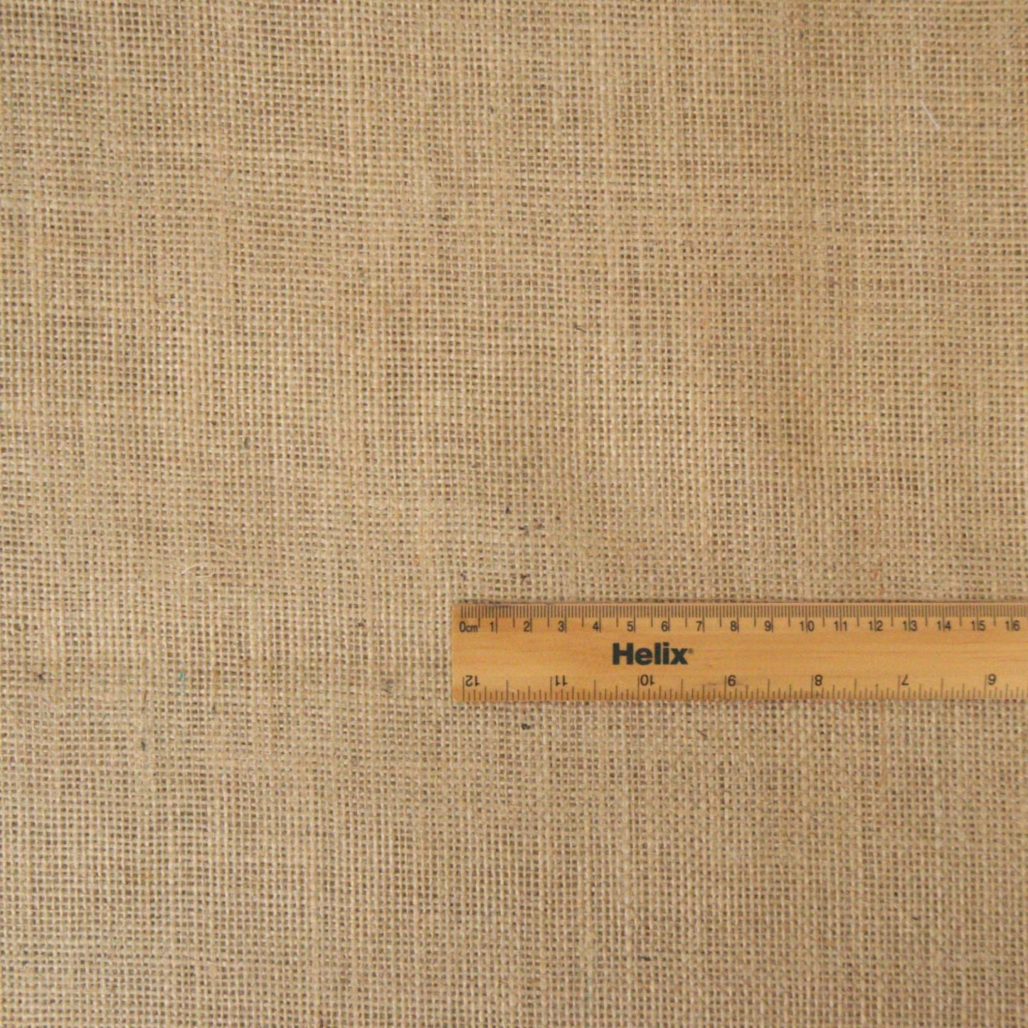 Natural jute hessian 10 ounce weight with a rule for scale