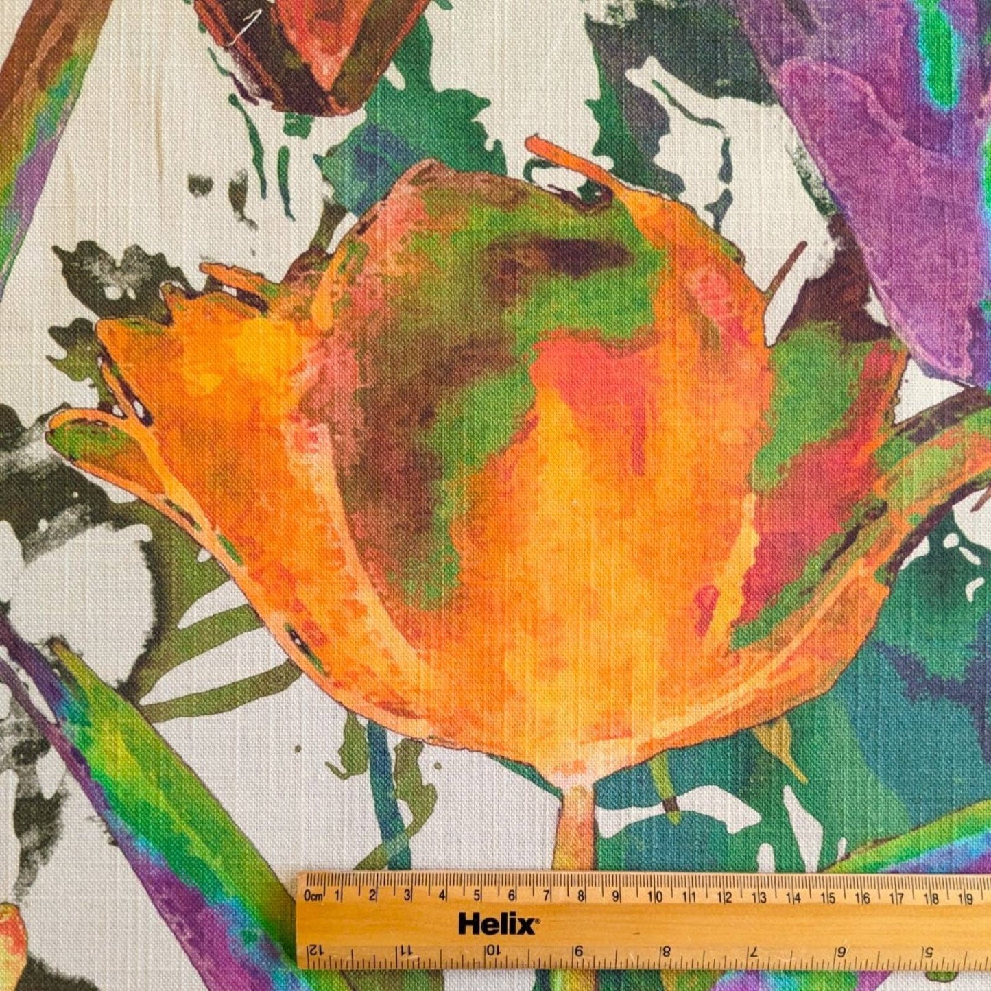 Tulip print fabric with a rule showing the size of the floral pattern