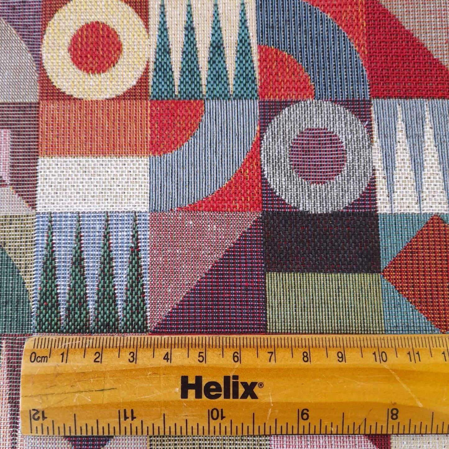 Tapestry fabric with checkerboard design and a rule for scale