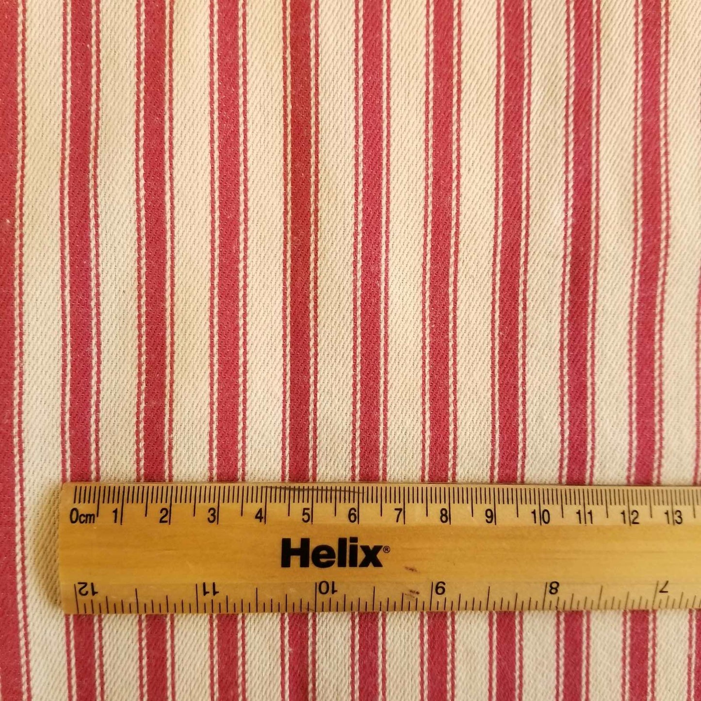 Soft Ticking Fabric with rule showing size of the red stripes