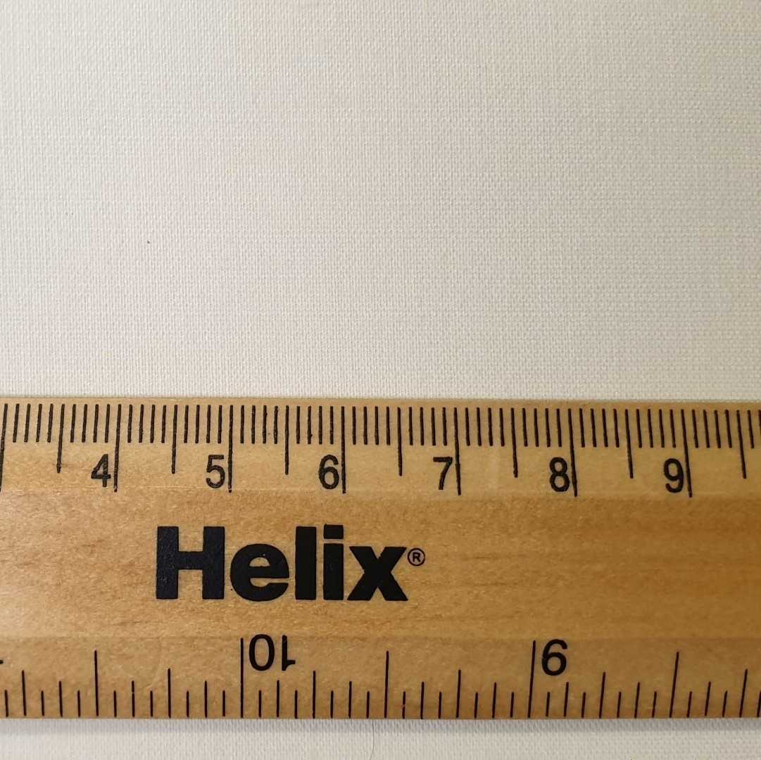 Cream blackout lining with a ruler showing the weave