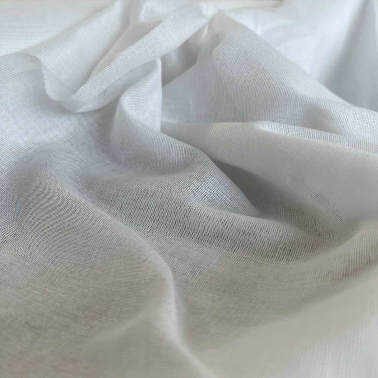 Bleached white muslin for windows or draping