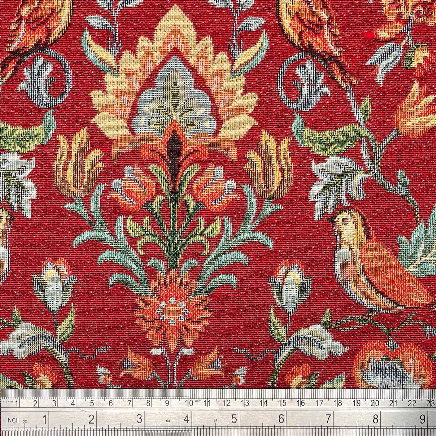 Red Tapestry fabric with a rule showing scale of William Morris birds and floral design