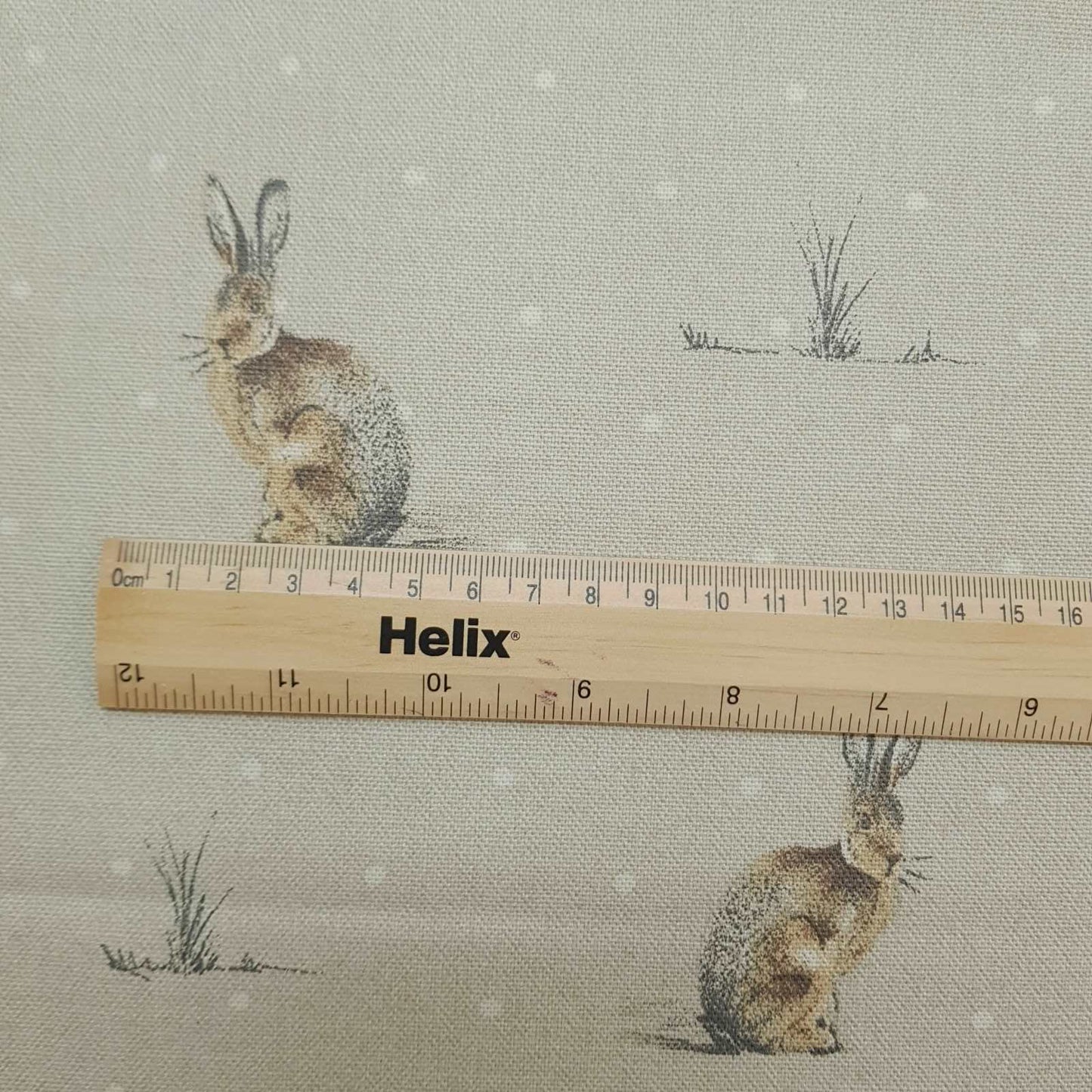 Curtain and blind fabric with a rule showing the size of the hare design print