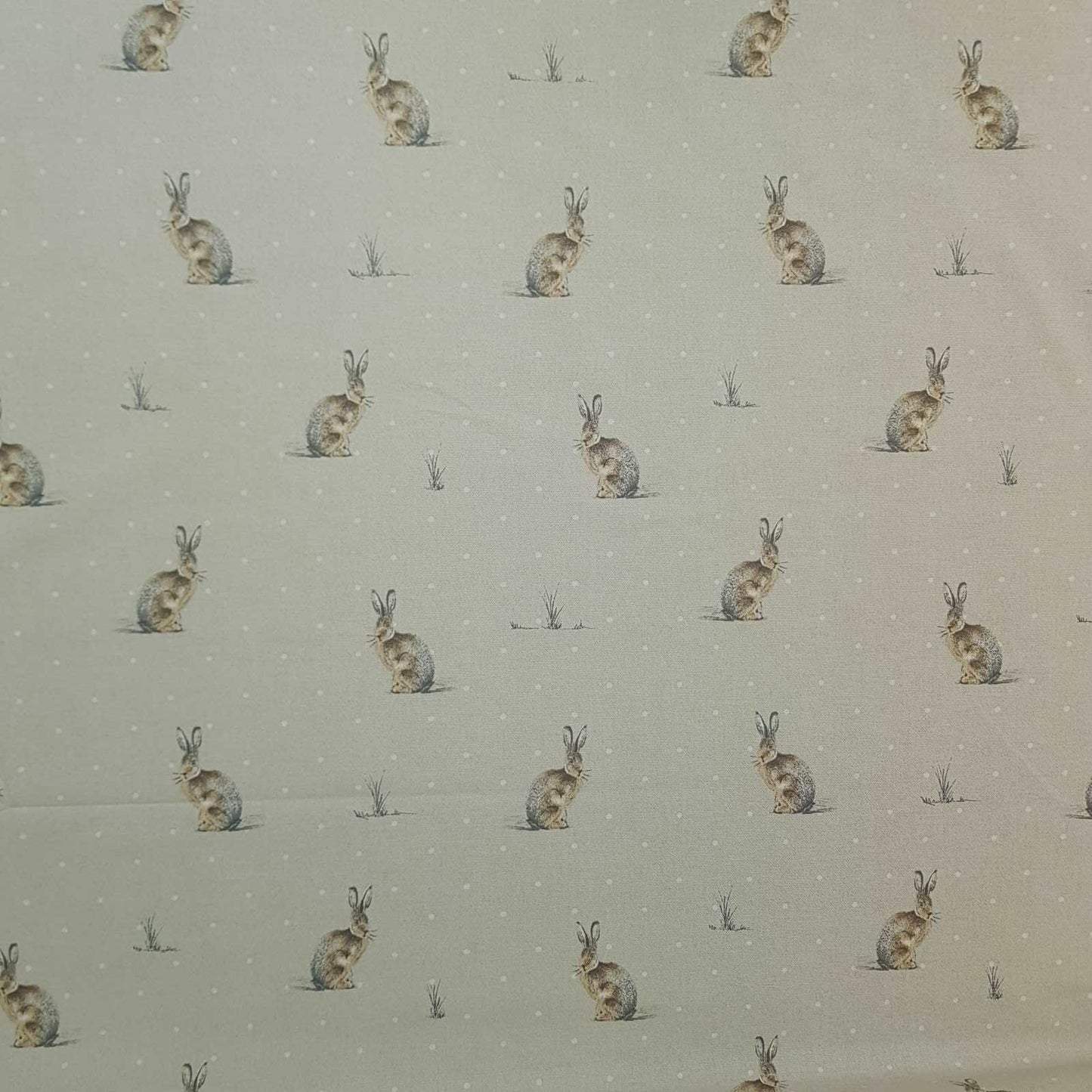 Curtain and blind fabric with a design of hares and white dots