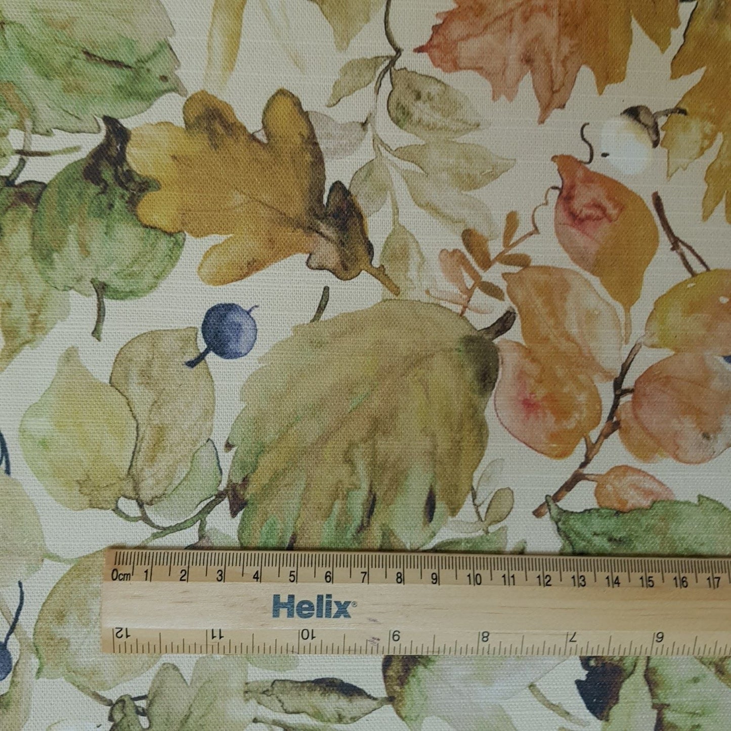 Curtain fabric with a rule showing scale of autumn leaves design