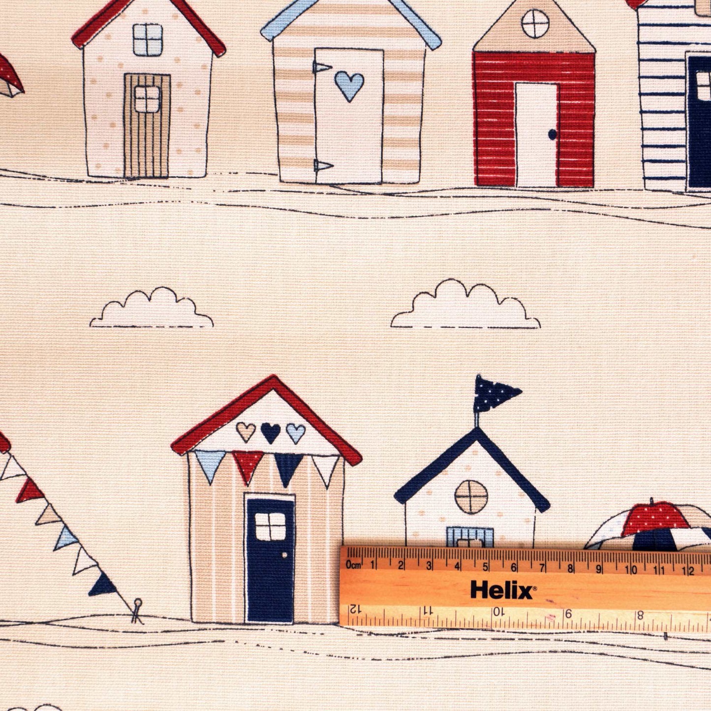 Curtain fabric with a rule showing scale of beach huts design