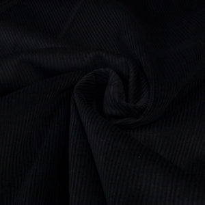 Black corduroy ribbed fabric for dressmaking or upholstery