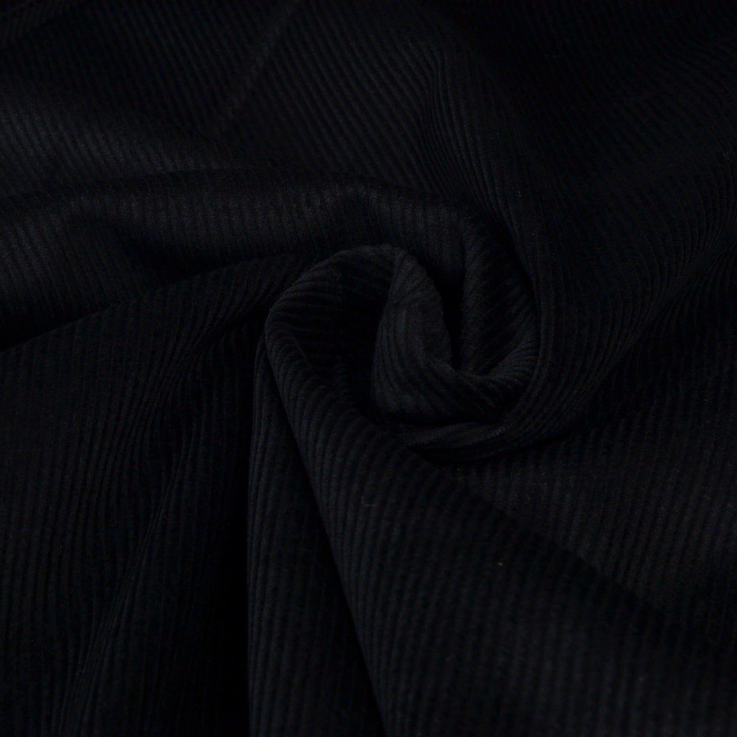 Black corduroy ribbed fabric for dressmaking or upholstery
