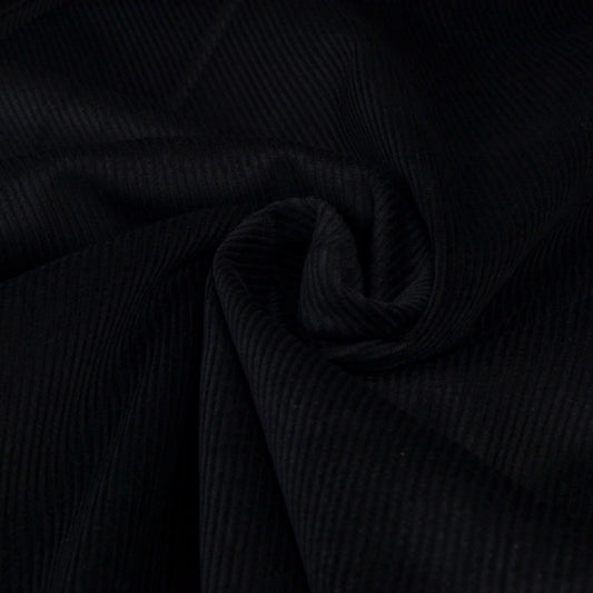 Black corduroy ribbed fabric for dressmaking or upholstery