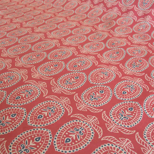 Red block print fabric with floral design 