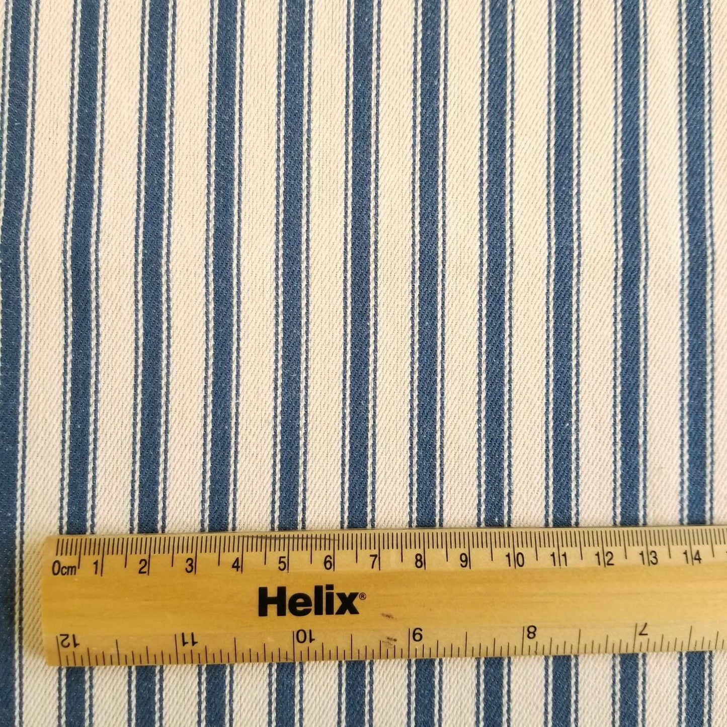 Soft Ticking Fabric with rule showing size of the blue stripes