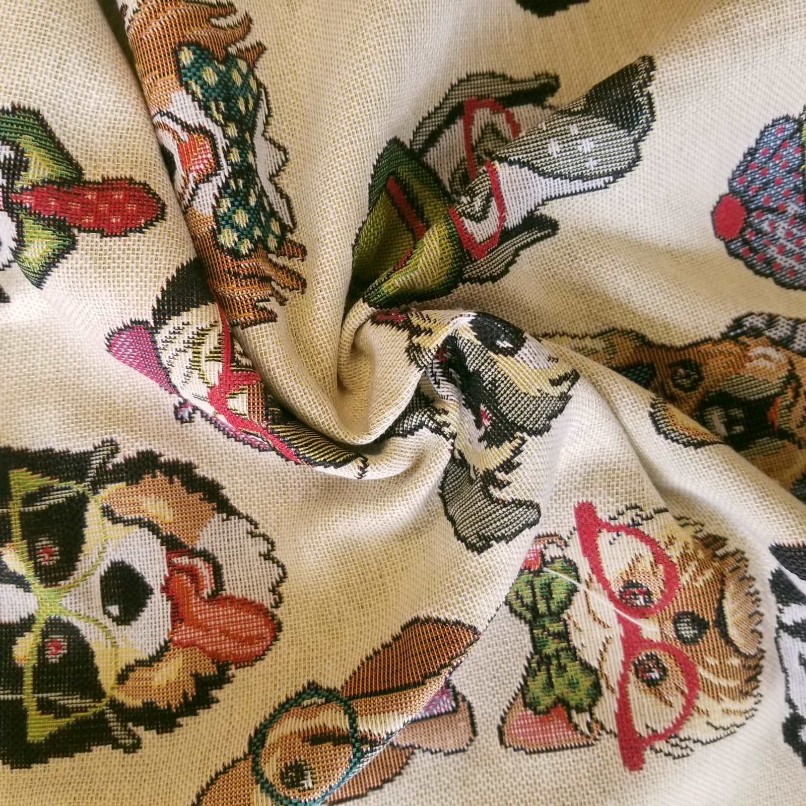 Tapestry fabric with a design of multicolour cartoon dog faces for curtains or upholstery