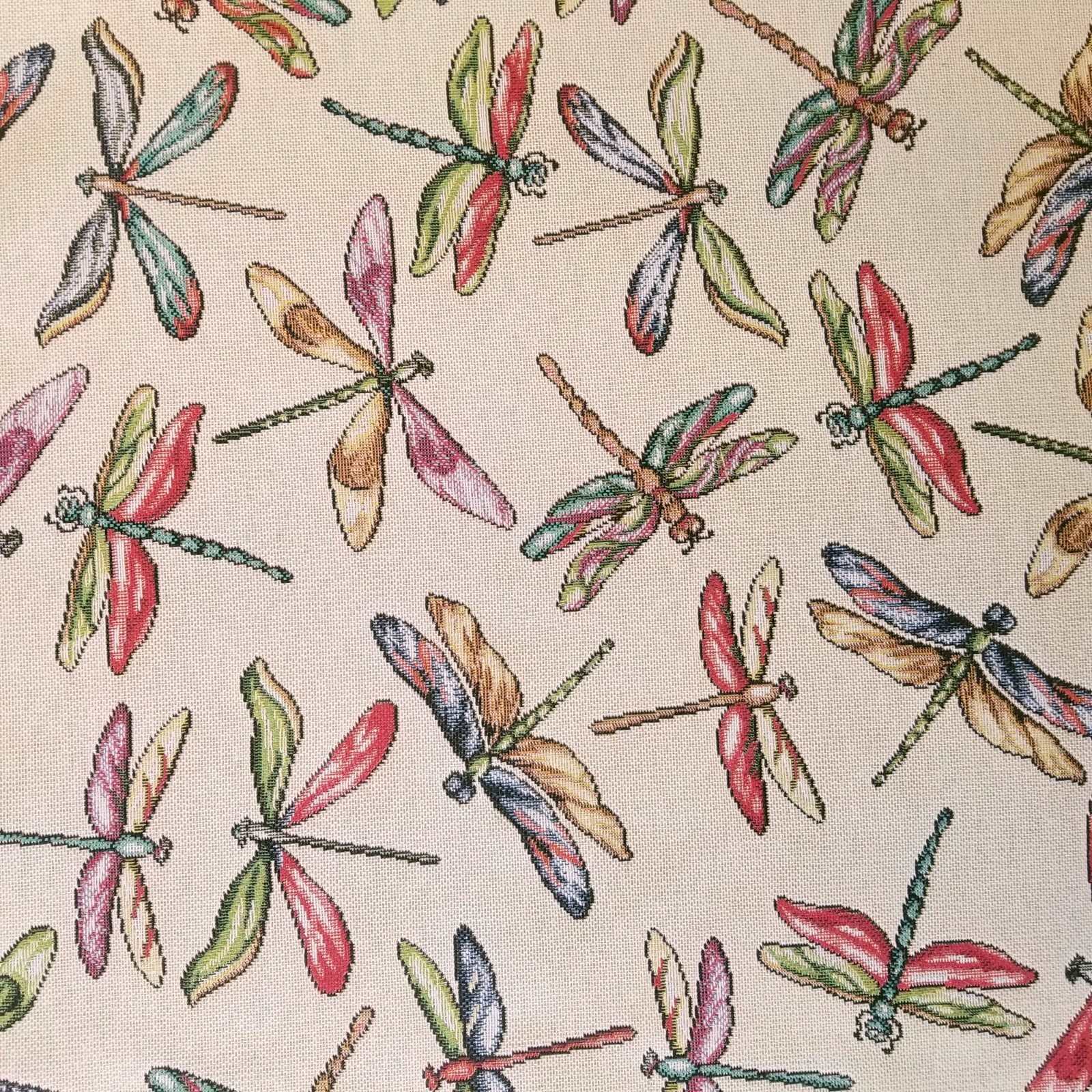 Colourful Dragonfly tapestry furnishing fabric on a cream background