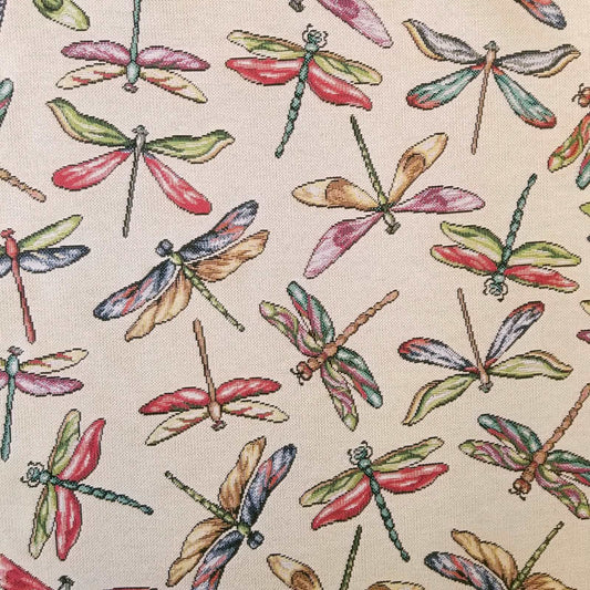 Colourful Dragonfly tapestry furnishing fabric on a cream background