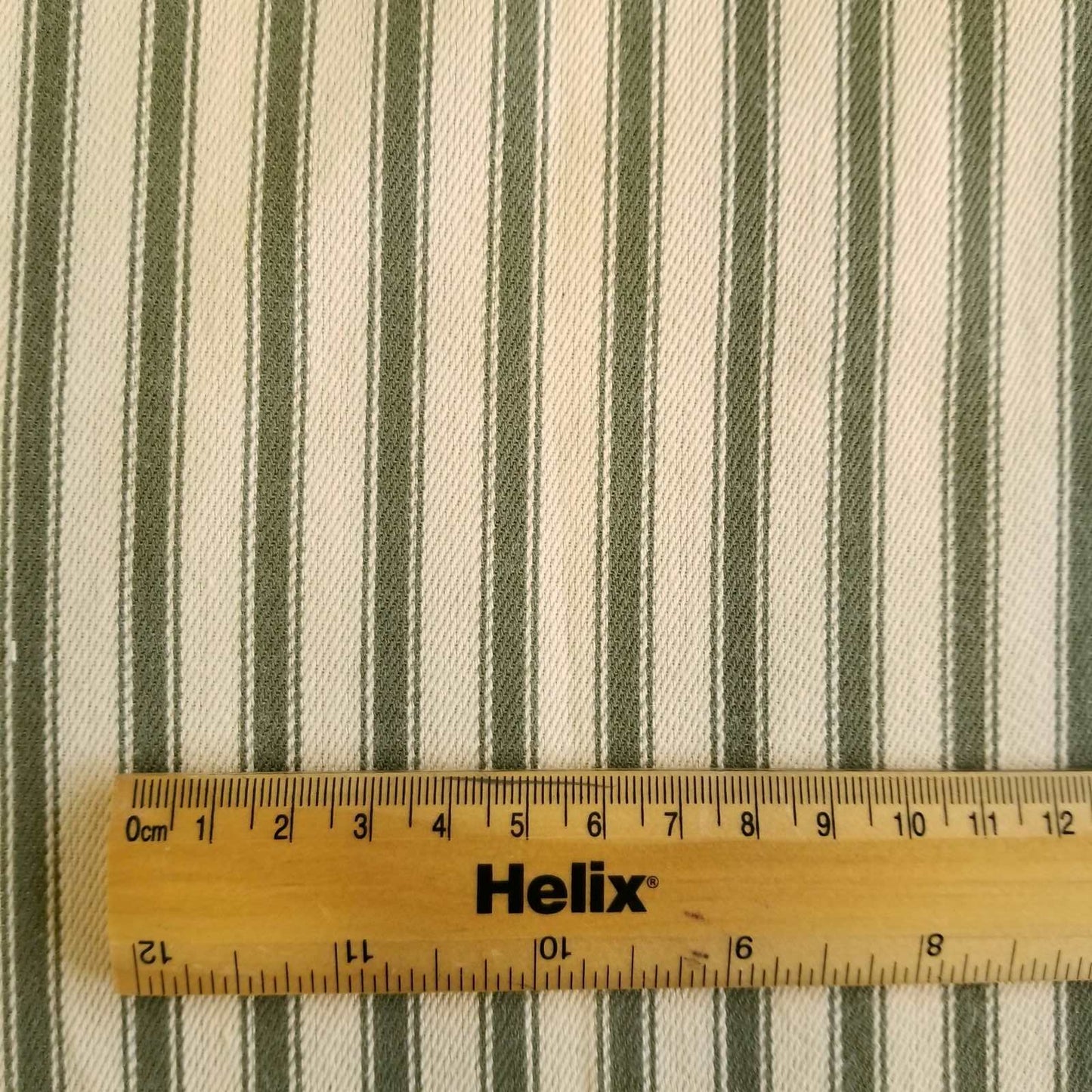 Soft Ticking Fabric with rule showing size of the green stripes