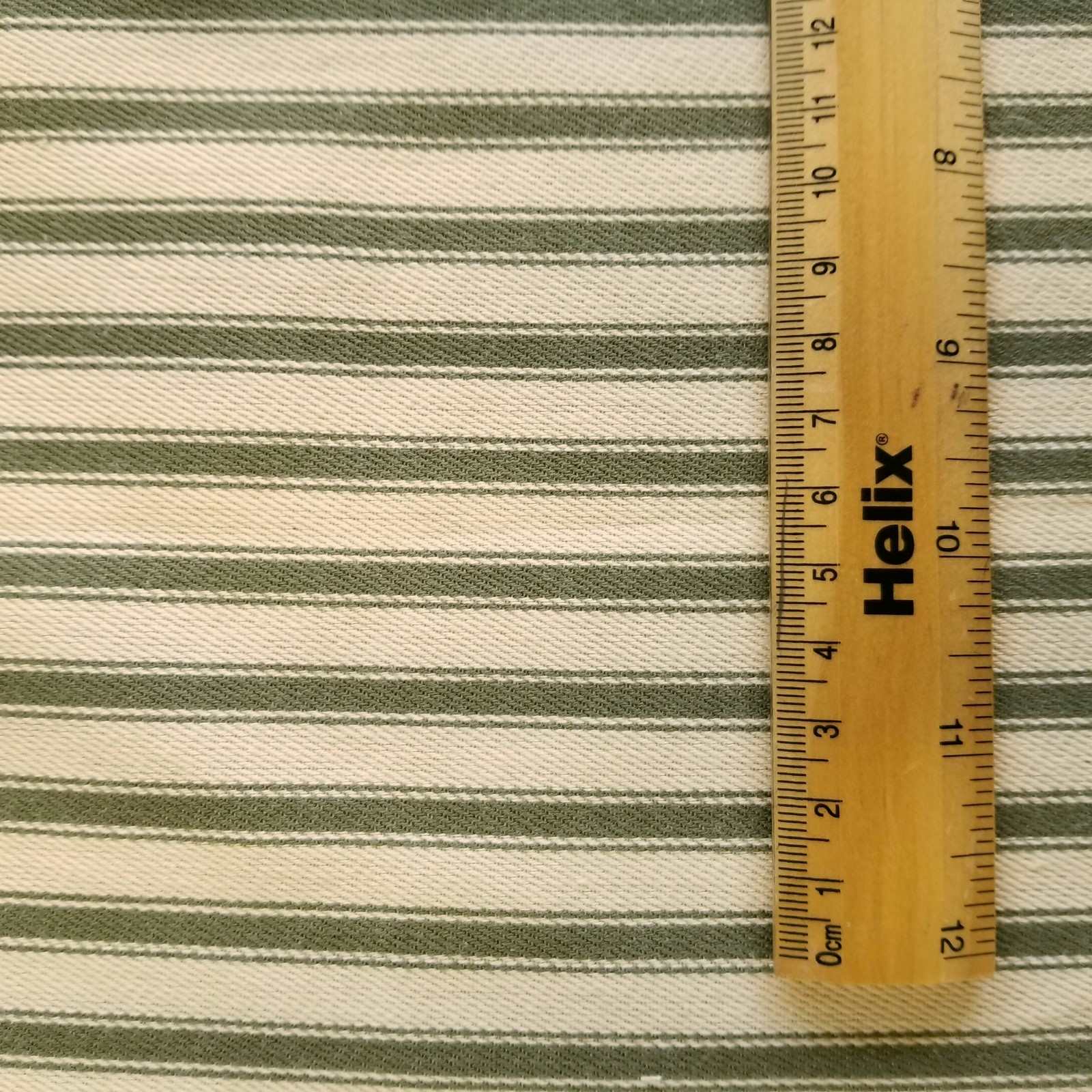 Soft Ticking Fabric with rule showing size of the green stripes