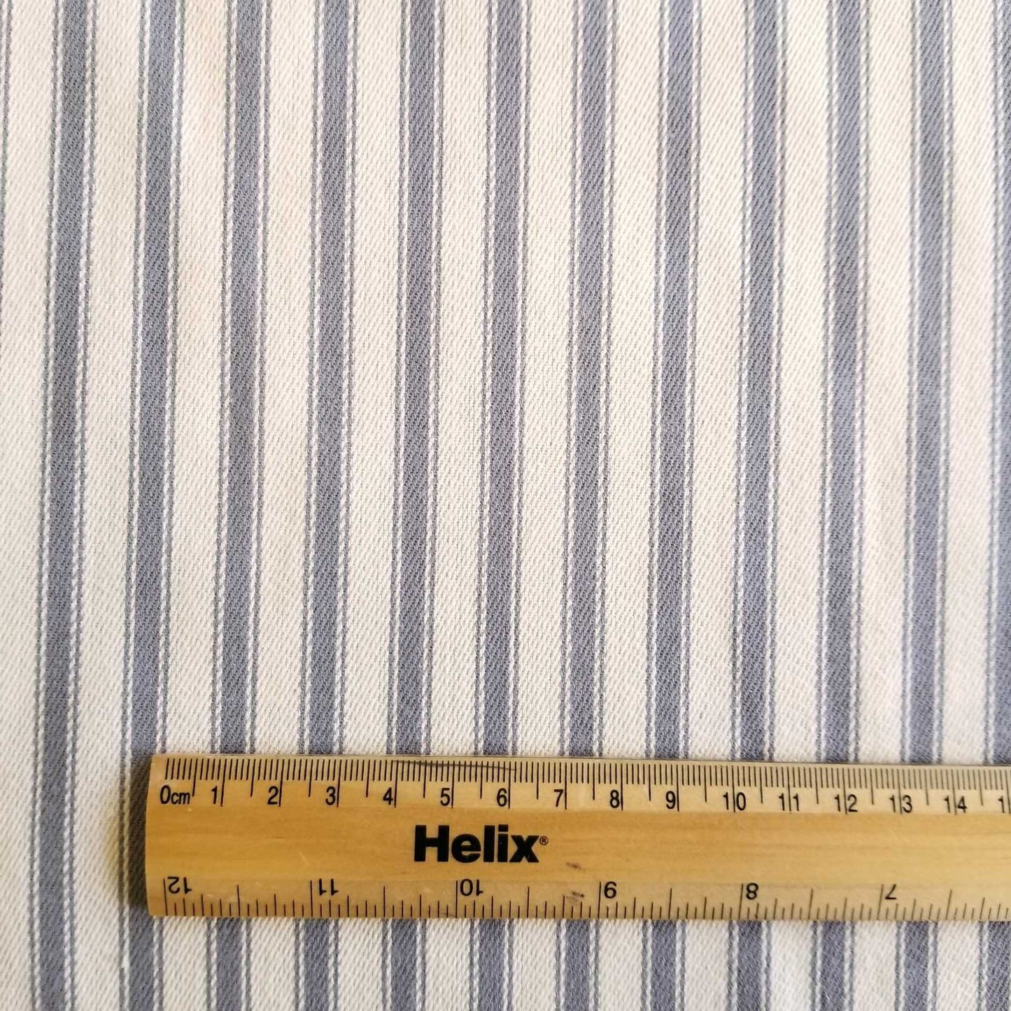 Soft Ticking Fabric with rule showing size of the grey stripes