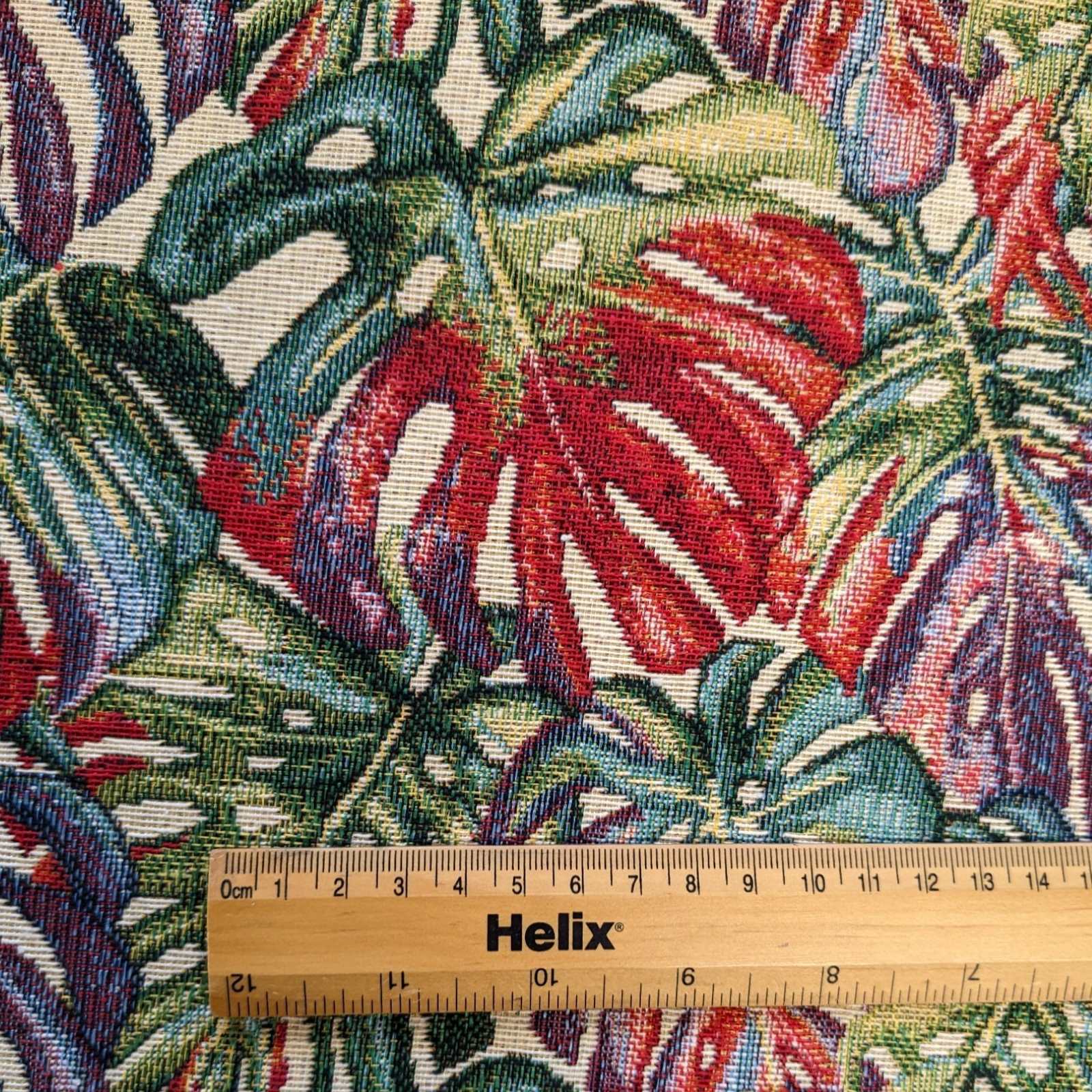 Green leaf tapestry fabric with a rule showing scale of design