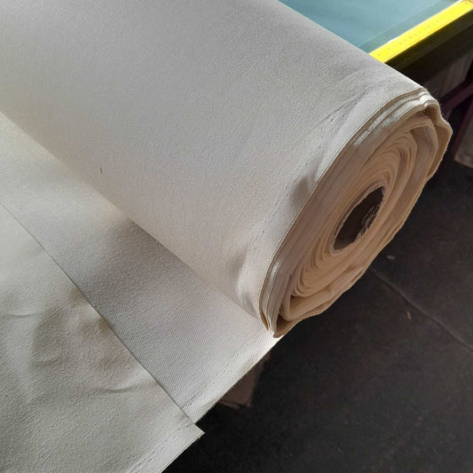 A roll of fire retardant roller blind stiffening fabric for use with own fabric