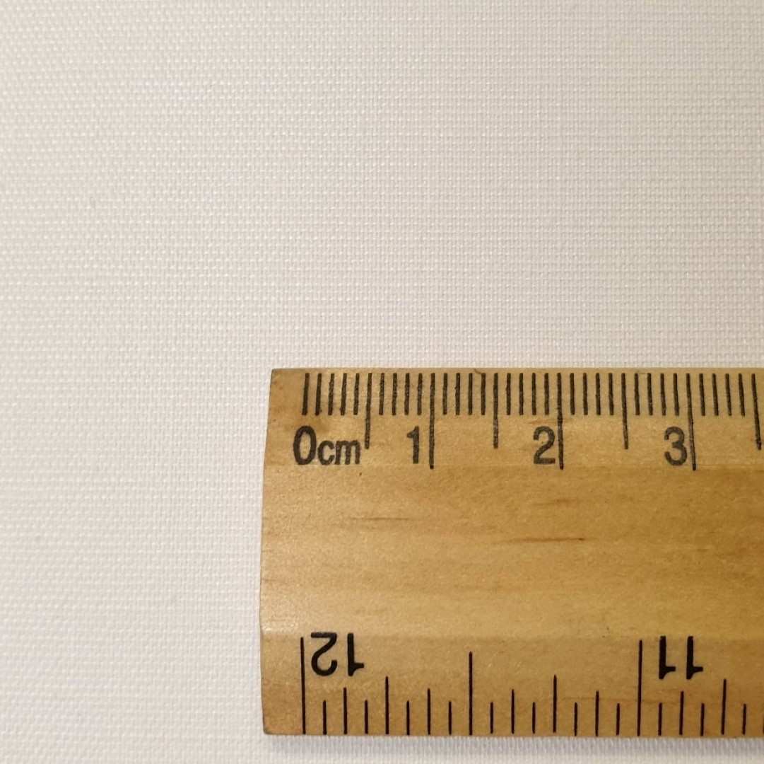 Cream thermal curtain lining with a rule for scale
