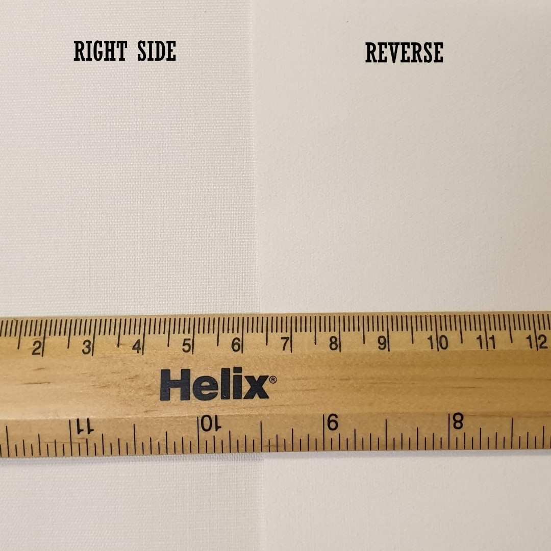 Front and reverse sides of cream thermal coated curtain lining