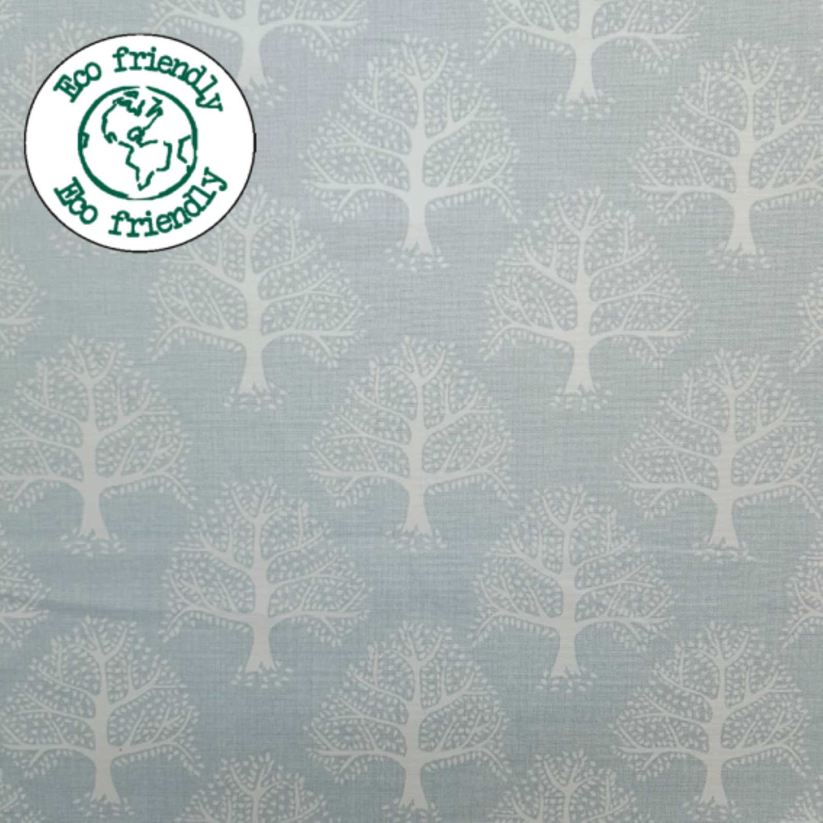Light Blue Fabric with a print of oak trees and and eco friendly badge