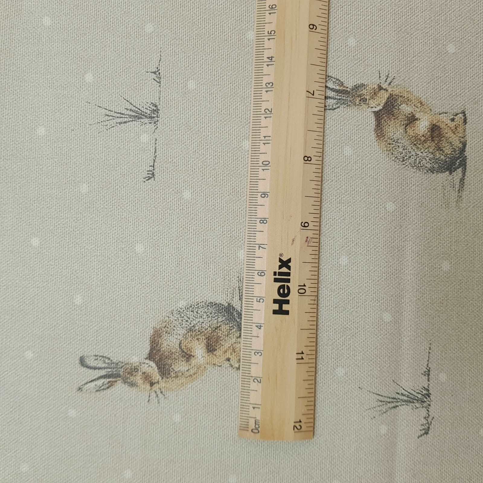 Curtain and blind fabric with a rule showing the size of the hare design print
