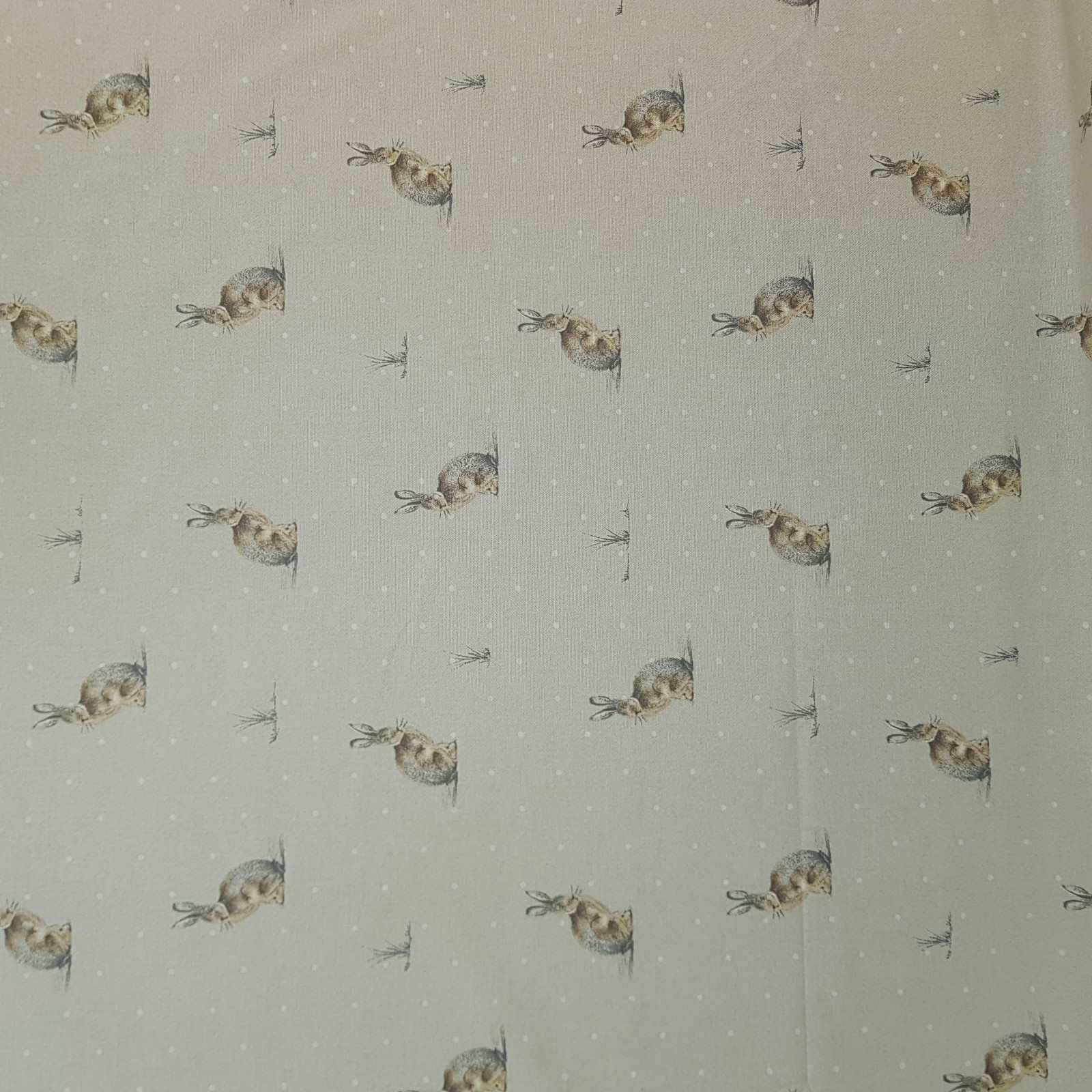Curtain and blind fabric with a design of hares and white dots