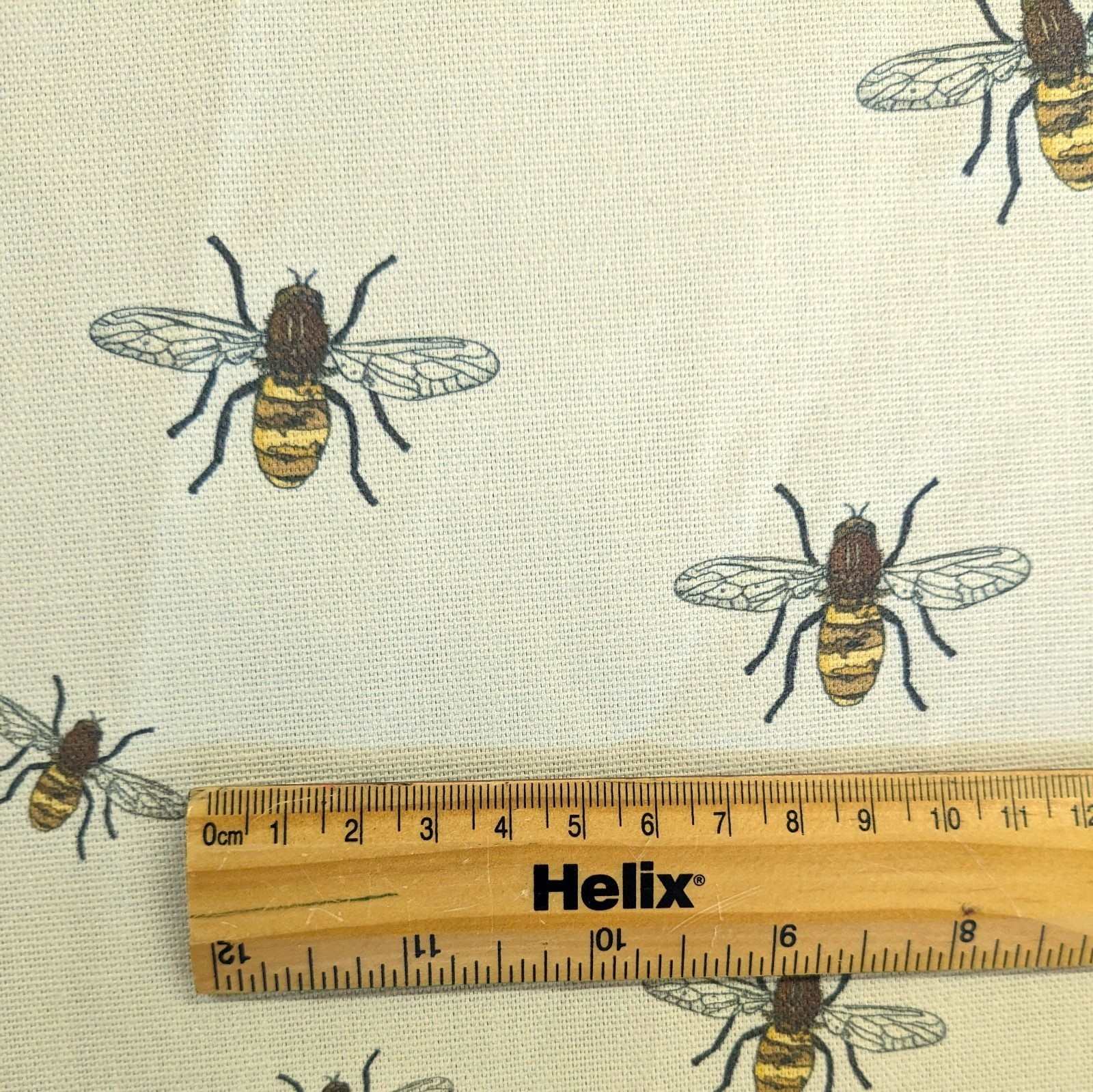 Furnishing fabric with a rule showing the size of the honey bees print
