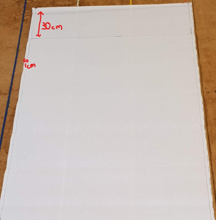 Roller blind backing marked for cutting to size for a roller blind