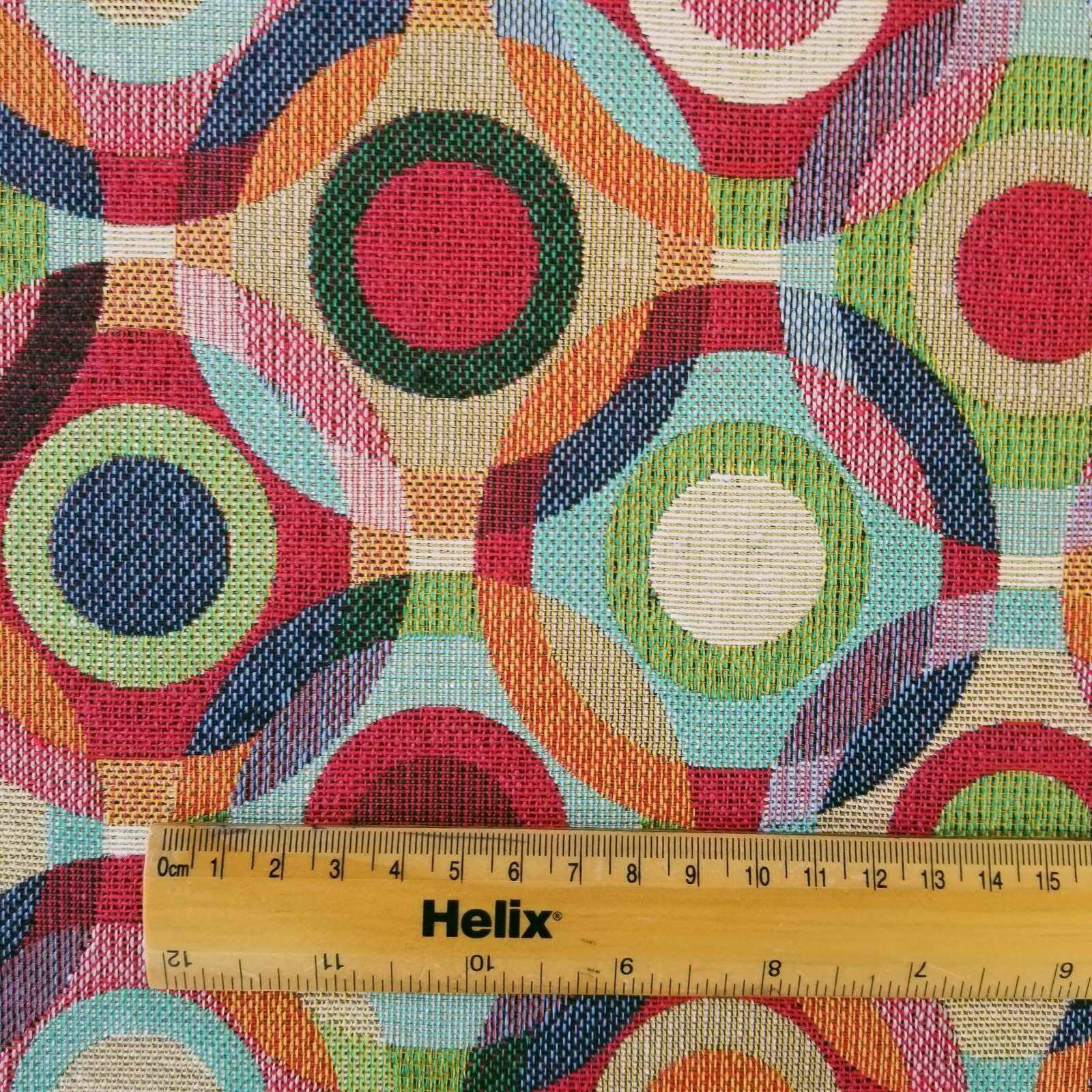 Multicolour tapestry fabric with a rule for scale of circles design